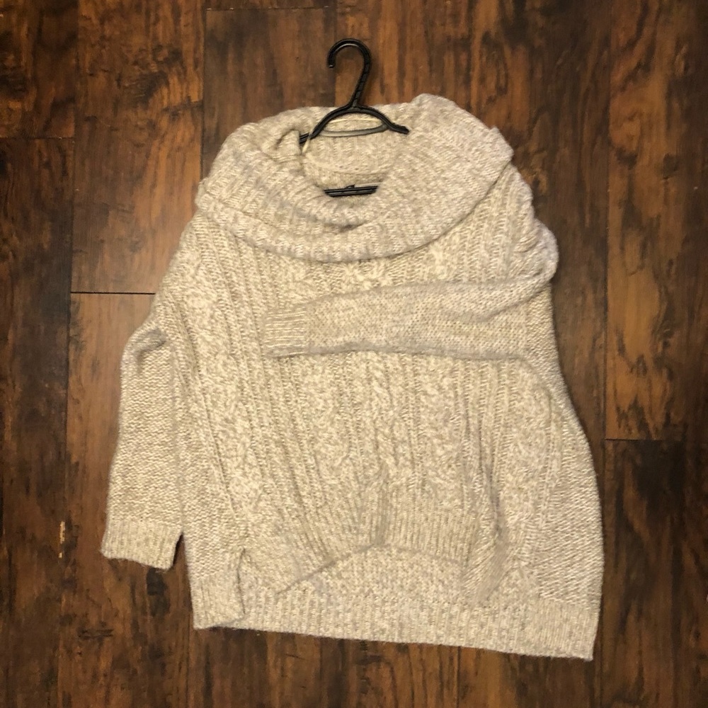Jennifer Lopez sweater. Thick sparkly gold accent.